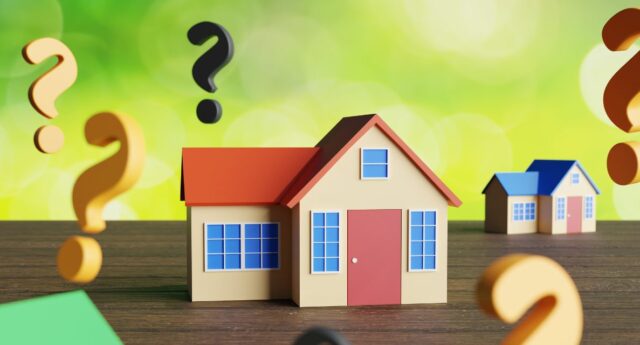 maisons miniatures et points d'interrogations en 3D