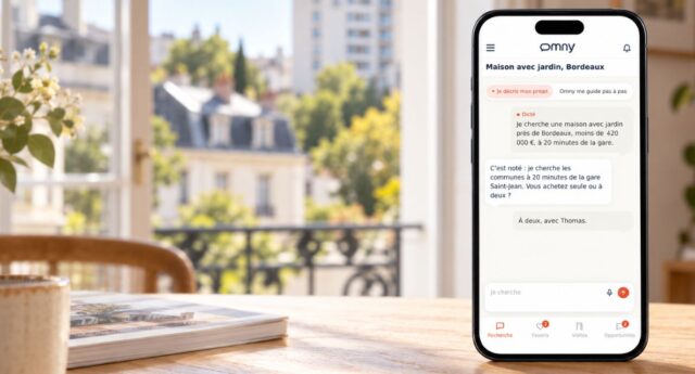 éléphone affichant l’assistant immobilier Omny, posé devant une fenêtre donnant sur des immeubles